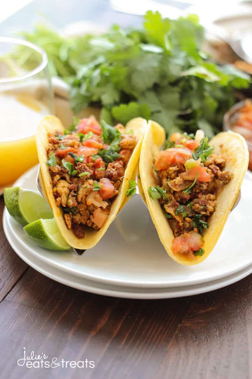 Chorizo Breakfast Tacos - Delicious breakfast tacos filled with scrambled eggs, vegetables, beans and chorizo. Sit down and enjoy some breakfast tacos with the family!