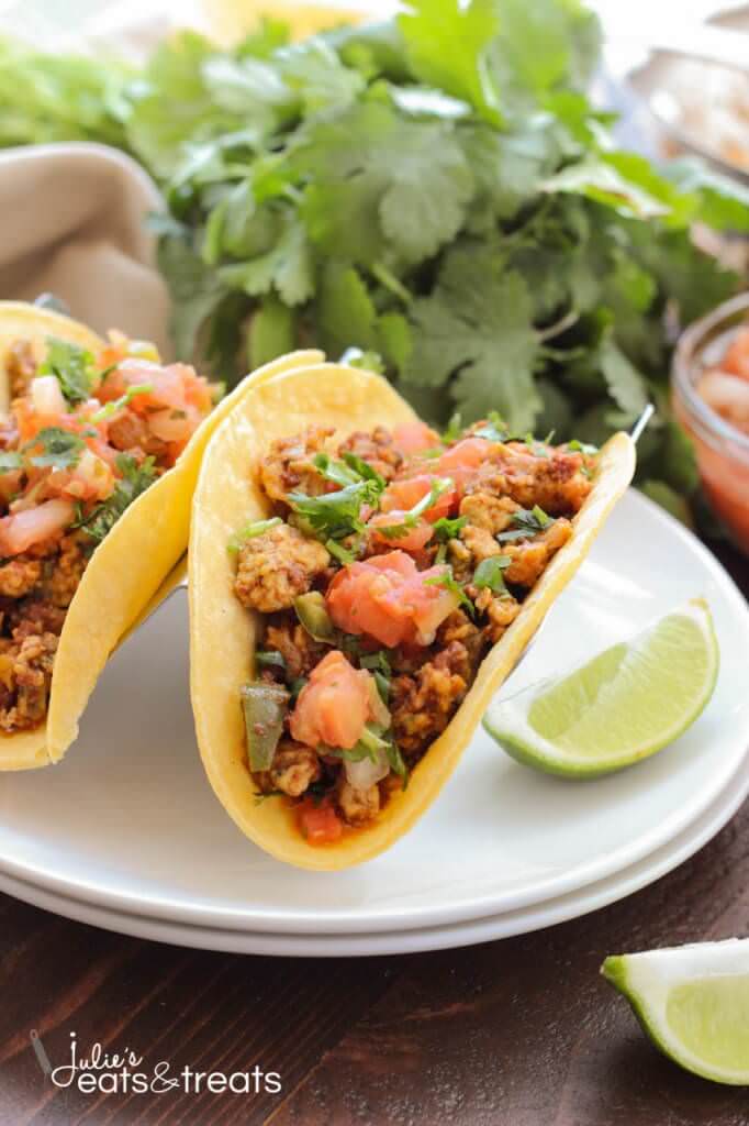 Chorizo Breakfast Tacos ~ Soft scrambled eggs mixed with chorizo and vegetables, then stuffed into a corn tortilla with beans. Topped with some salsa, pico de gallo and cheese. This is a breakfast dish you won't want to miss!