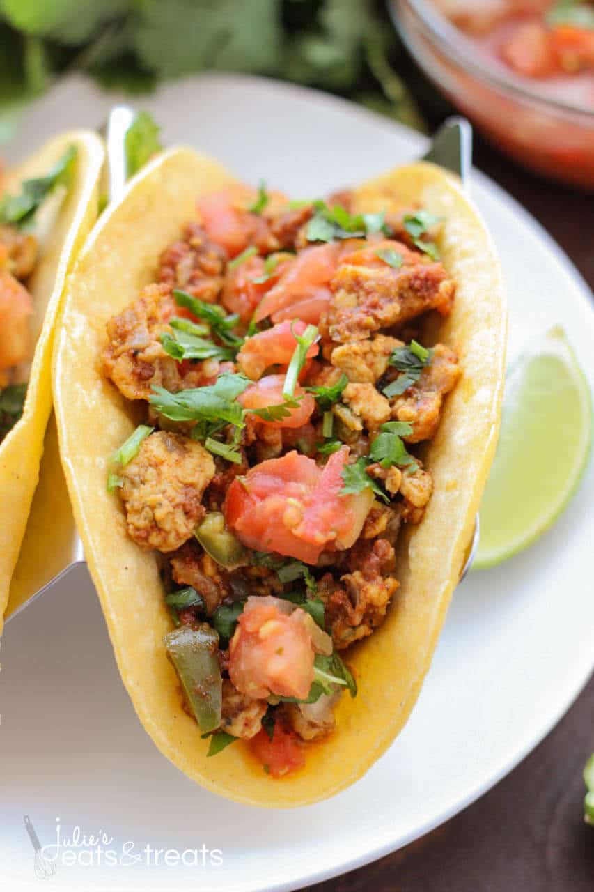 Chorizo Breakfast Tacos - Delicious breakfast tacos filled with scrambled eggs, vegetables, beans and chorizo. Sit down and enjoy some breakfast tacos with the family!