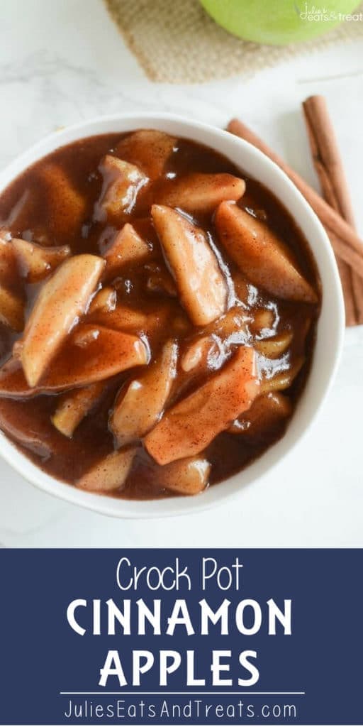 Crock pot cinnamon apples in a white bowl with cinnamon sticks