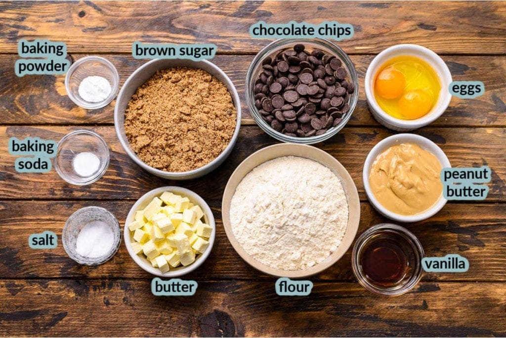 ingredients needed to make cookie bars like butter eggs flour brown sugar chocolate chips in bowls