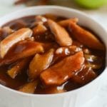 White bowl of crock pot cinnamon apples