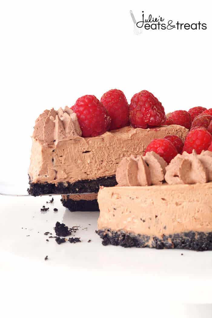 A slice of No Bake Chocolate Cheesecake topped with Raspberries.