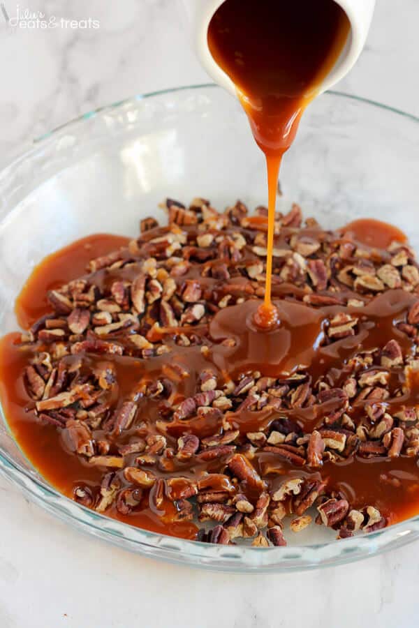 Easy Caramel Pecan Sticky Buns ~ Tender and gooey melt-in-your-mouth sticky buns topped with caramel sauce and chopped pecans. This easy recipe uses canned crescent roll dough and prepared caramel sauce!