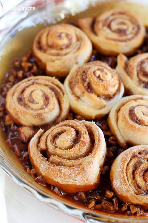 Easy Caramel Pecan Sticky Buns ~ Tender and gooey melt-in-your-mouth sticky buns topped with caramel sauce and chopped pecans. This easy recipe uses canned crescent roll dough and prepared caramel sauce!