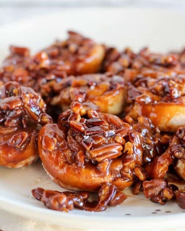 Easy caramel pecan sticky buns on a white plate