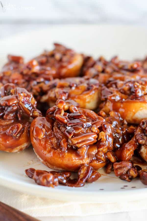 Easy Caramel Pecan Sticky Buns ~ Tender and gooey melt-in-your-mouth sticky buns topped with caramel sauce and chopped pecans. This easy recipe uses canned crescent roll dough and prepared caramel sauce!