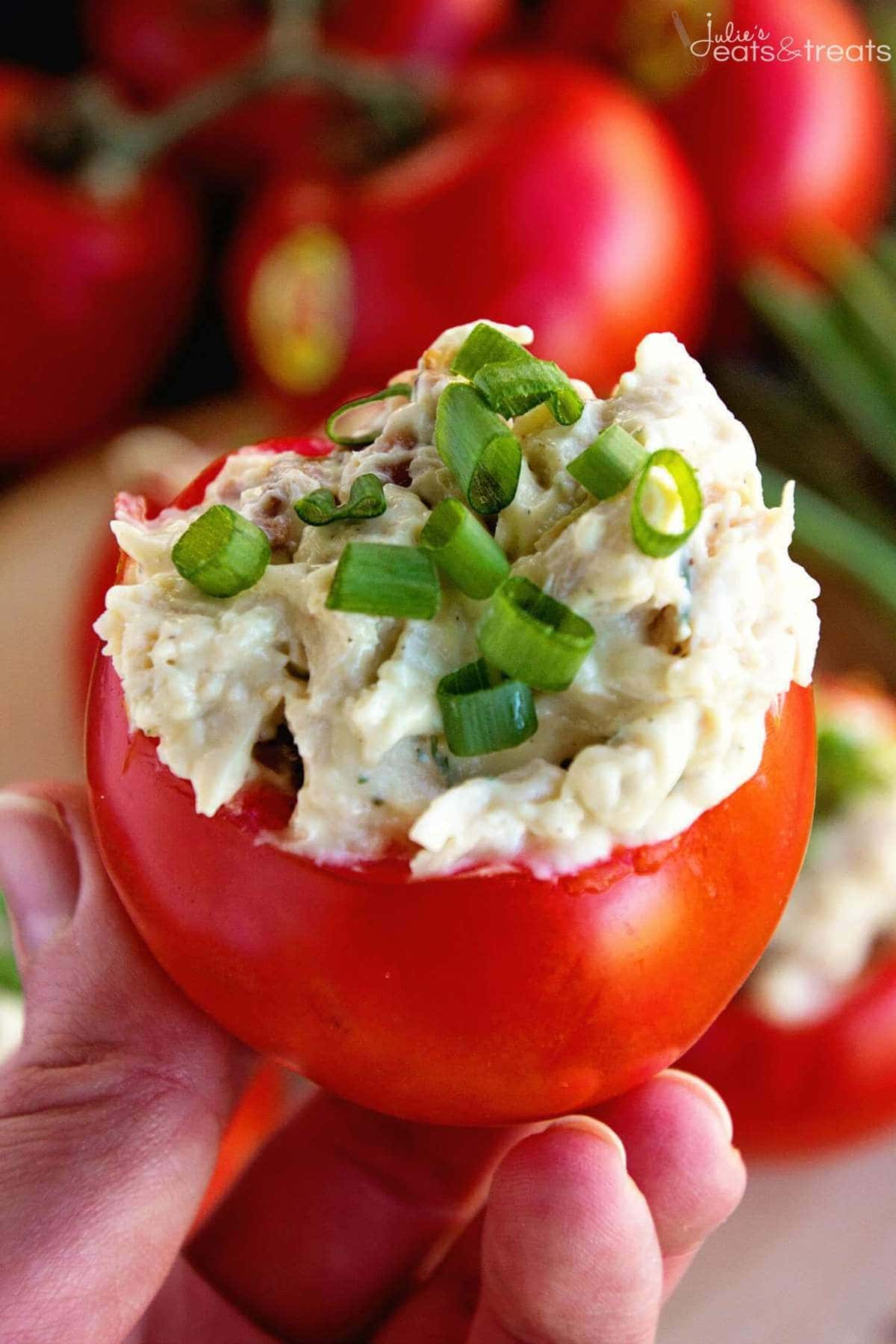 Chicken Salad Stuffed Tomatoes in hand