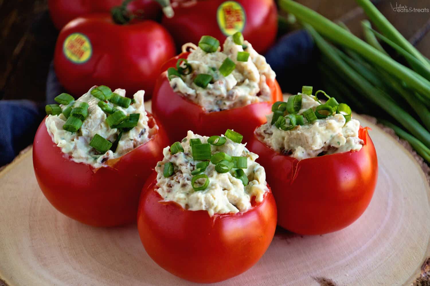 Stuffed Tomatoes Recipe on wood cutting board