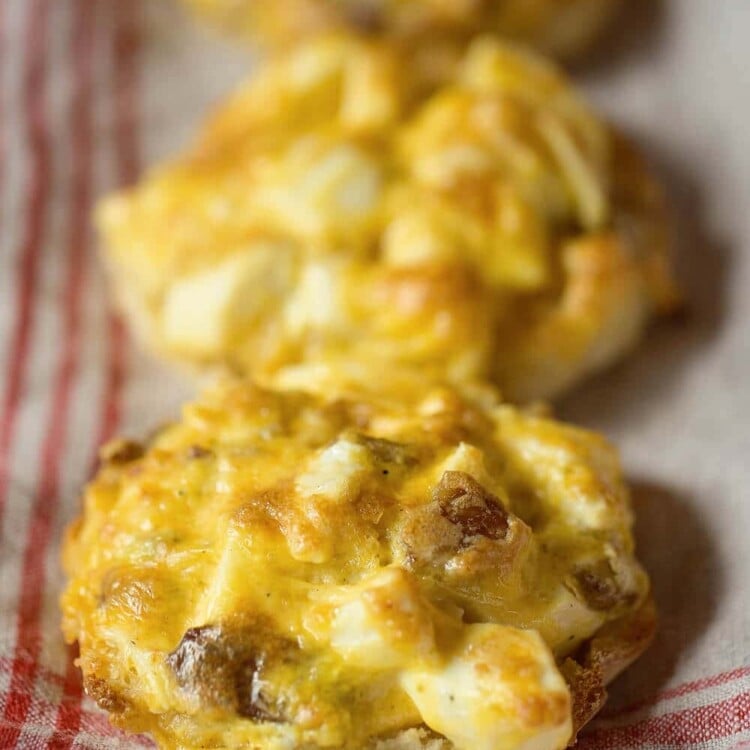 Make-Ahead Breakfast Muffin Melts ~ Melted Cheese, Warm Eggs and Bacon Piled on an English Muffin! Make Them Ahead, Warm Up and it's the Perfect Grab and Go Breakfast for on the Run!