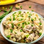 Roasted Red Potato Salad in bowl garnished with green onions