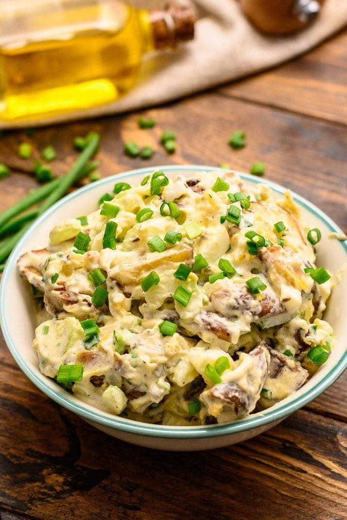 Roasted Red Potato Salad in bowl garnished with green onions