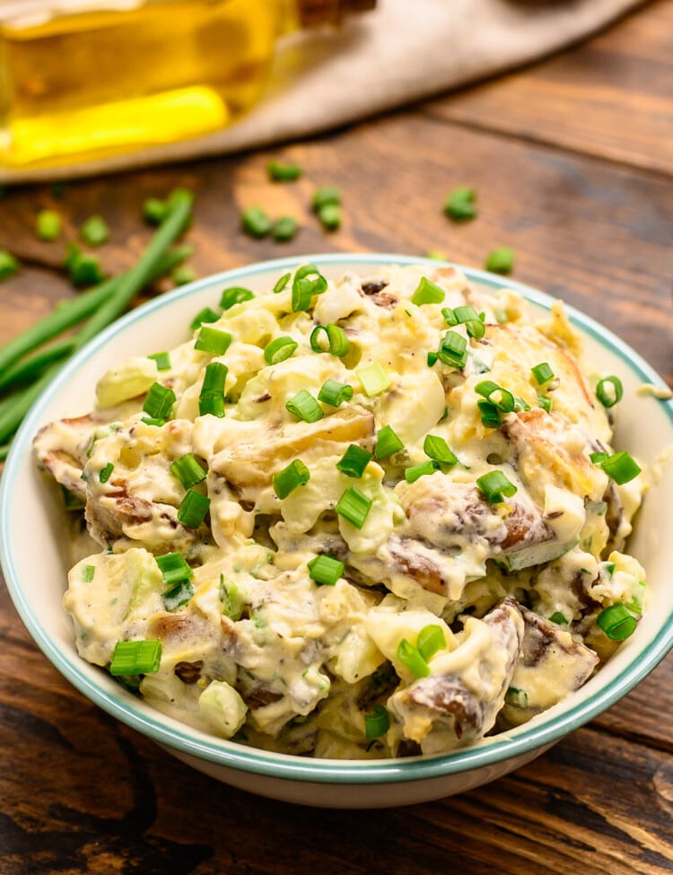 Roasted Red Potato Salad in bowl garnished with green onions
