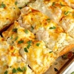 Shrimp & Artichoke French Bread - A perfect appetizer made with a cheesy, creamy topping filled with shrimp and artichokes!