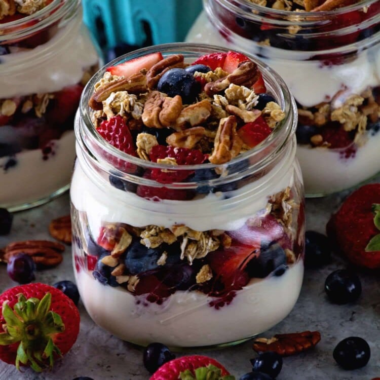 Berry Yogurt Breakfast Parfait ~ Quick, Healthy Breakfast for Mornings When You Are on the Go! Layers of Greek Yogurt, Granola, Strawberries, Blueberries, Raspberries and Pecans!