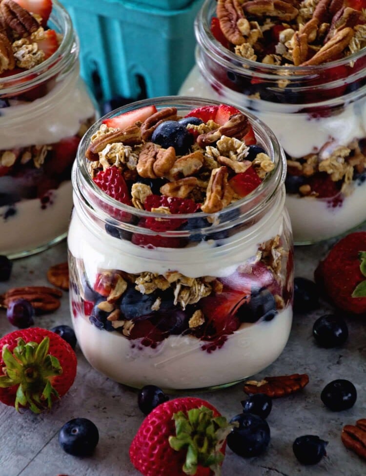 Berry Yogurt Breakfast Parfait ~ Quick, Healthy Breakfast for Mornings When You Are on the Go! Layers of Greek Yogurt, Granola, Strawberries, Blueberries, Raspberries and Pecans!