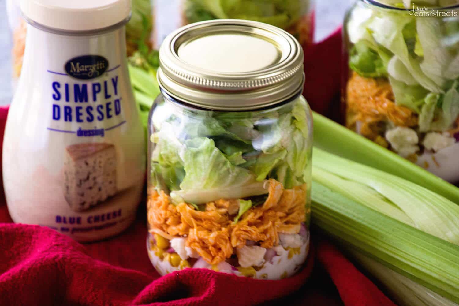 Buffalo Chicken Jar Salad ~ Easy, Light and Healthy Lunch Full of Flavor! Layers of Blue Cheese Dressing, Celery, Blue Cheese Crumbles, Corn, Onions, Buffalo Chicken and Lettuce!