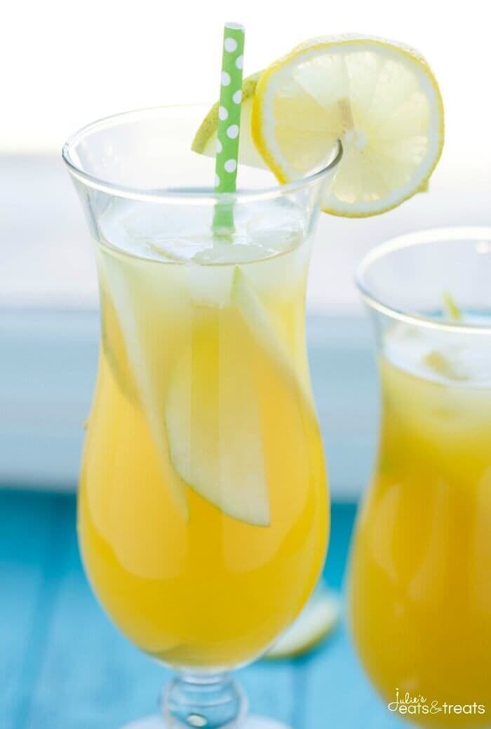 Pineapple Fruit Cocktail Drink Recipe ~ A blend of pineapple, apple, and orange juice are the stars of the show with this pineapple fruit cocktail. Served with sliced pear and the optional rum which are also refreshing for the summer!