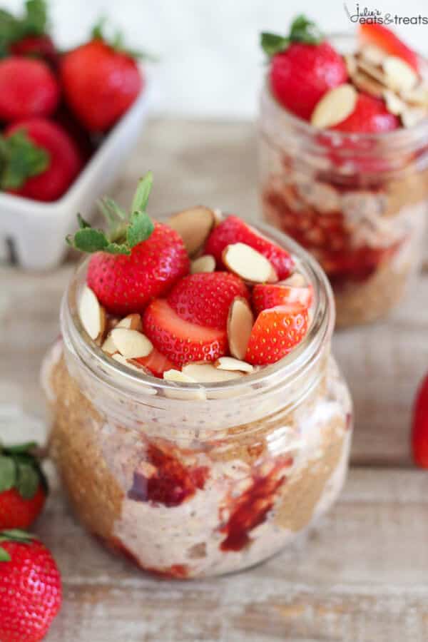 Overnight oats in jar with sliced strawberries and almonds for topping