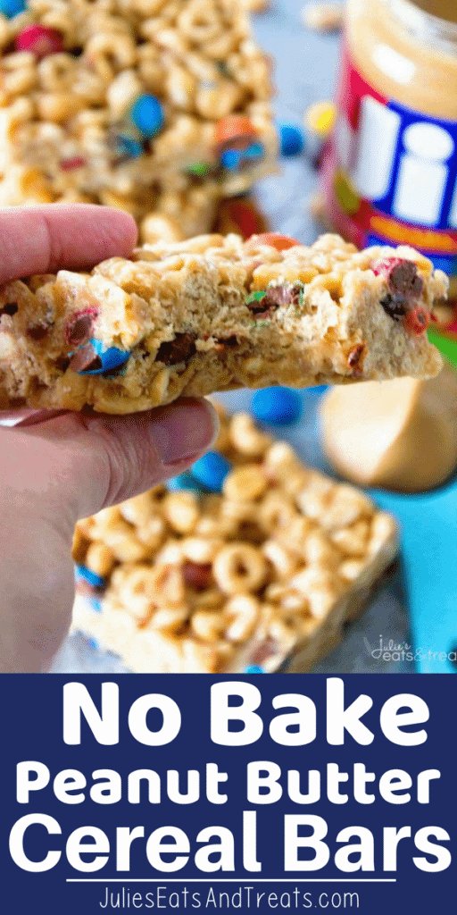 Cereal Bar with a bite out of it being held over a table with more bars on it