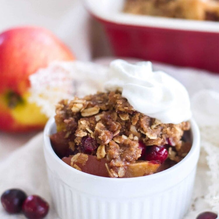 This easy fruit crisp recipe is filled with sweet apples and fresh cranberries, and is topped with the best brown sugar cinnamon crumble! A simple dessert perfect for the holiday season!