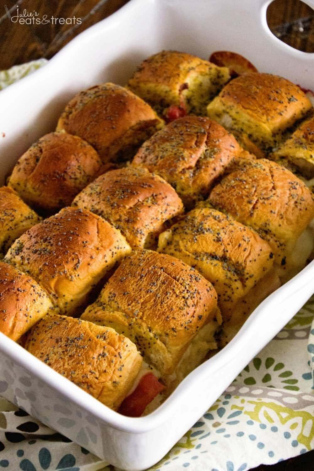 White baking dish with turkey sliders in it.