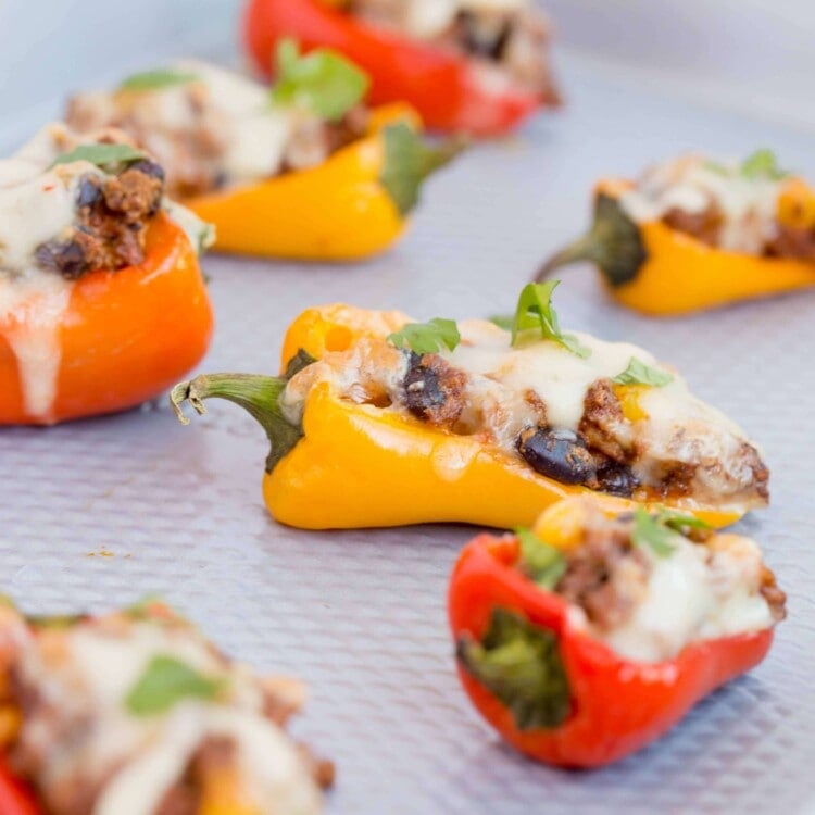 Sweet pepper poppers on a metal baking sheet