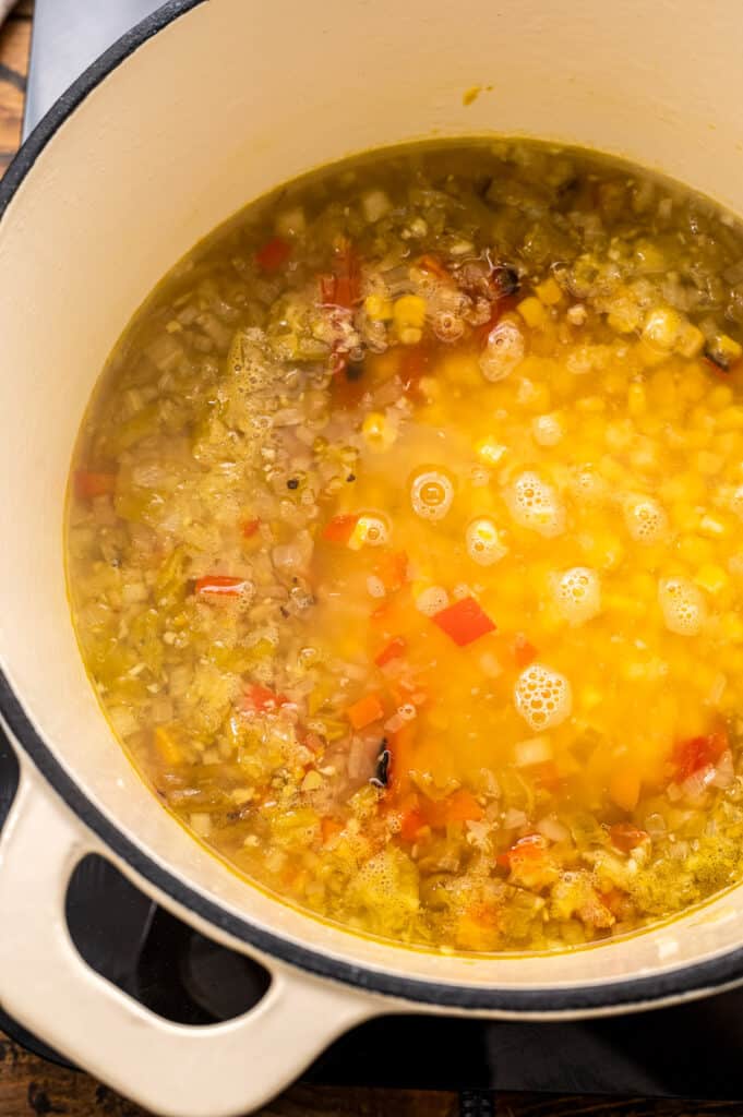 Stock pot with broth and vegetables for turkey chowder