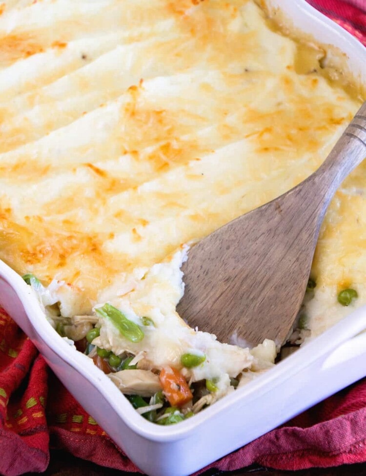 Turkey Shepherd's Pie ~ The Perfect Casserole to use up Leftover Turkey and Vegetables from the Holidays! Peas, Carrots and Beans with Gravy then Piled with Mashed Potatoes and Topped with Parmesan Cheese!