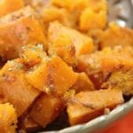 Slow cooker sweet potatoes in a green bowl