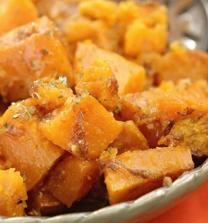 Slow cooker sweet potatoes in a green bowl