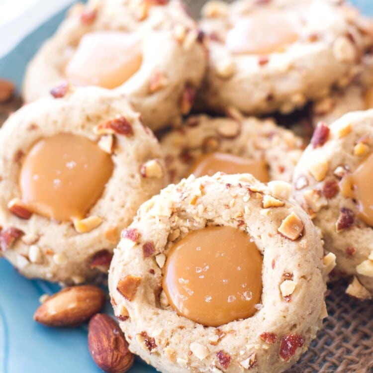 These easy salted caramel almond thumbprint cookies are perfect for any holiday party or cookie exchange! They’re sweet, slightly nutty, and incredibly rich with the salted caramel filling!