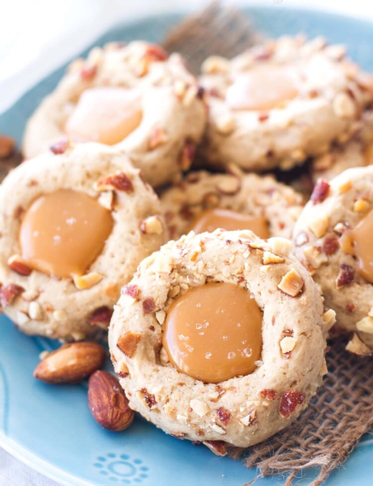 These easy salted caramel almond thumbprint cookies are perfect for any holiday party or cookie exchange! They’re sweet, slightly nutty, and incredibly rich with the salted caramel filling!