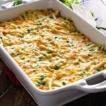 Cheesy chicken noodle casserole in a white baking dish