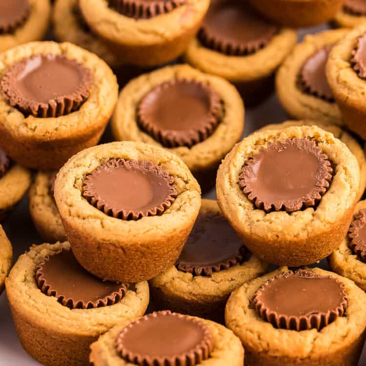 Peanut Butter Cup Cookies stacked on white plate