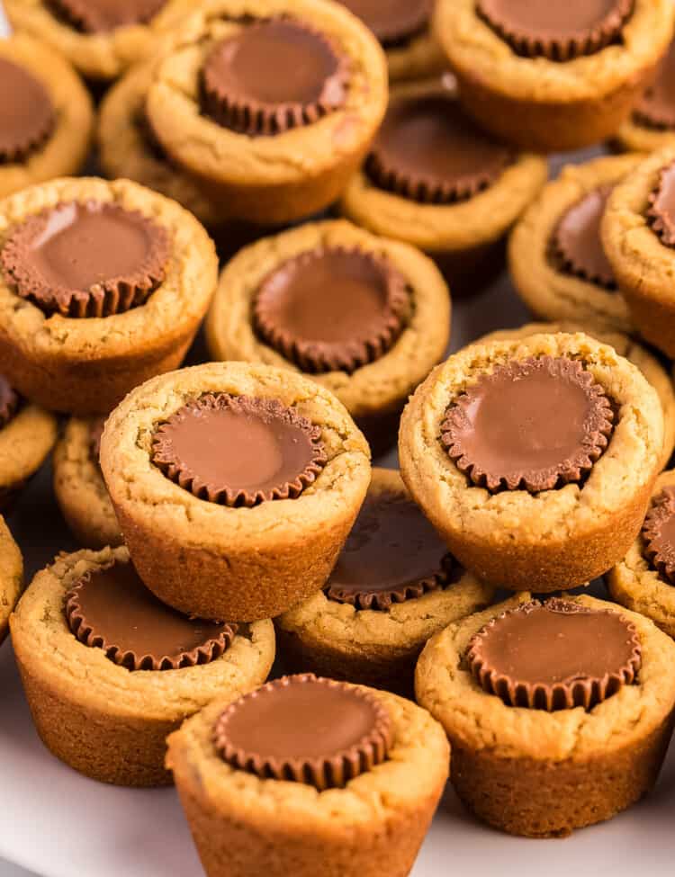 Peanut Butter Cup Cookies stacked on white plate