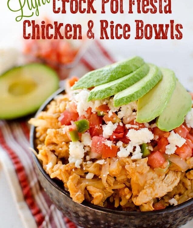 Light crock pot fiesta chicken and rice in a bowl topped with tomatoes and avocado slices