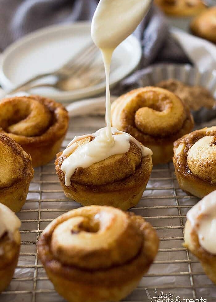 These Cinnamon Roll Muffins are filled with cinnamon and sugar then drizzled with a vanilla icing!