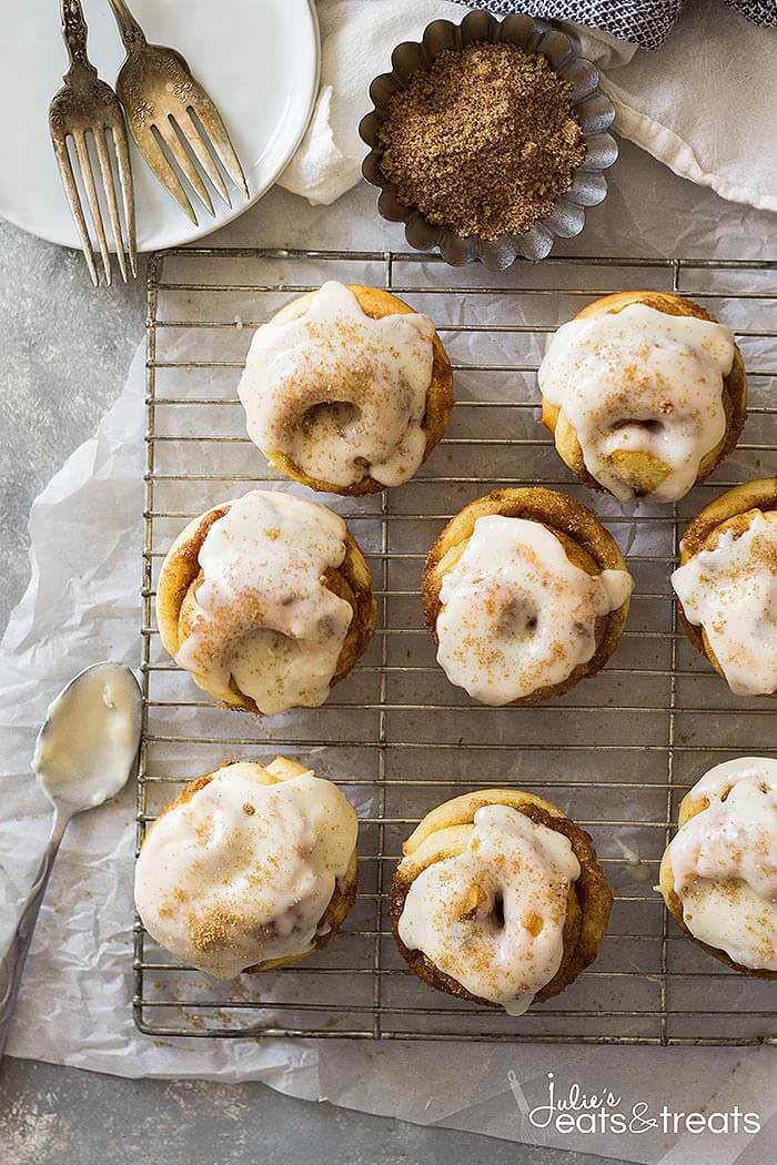 Overhead image of frosted Cinnamon Roll Muffins on baking rack.