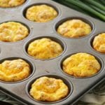 Ham and cheese egg muffins in a muffin tin