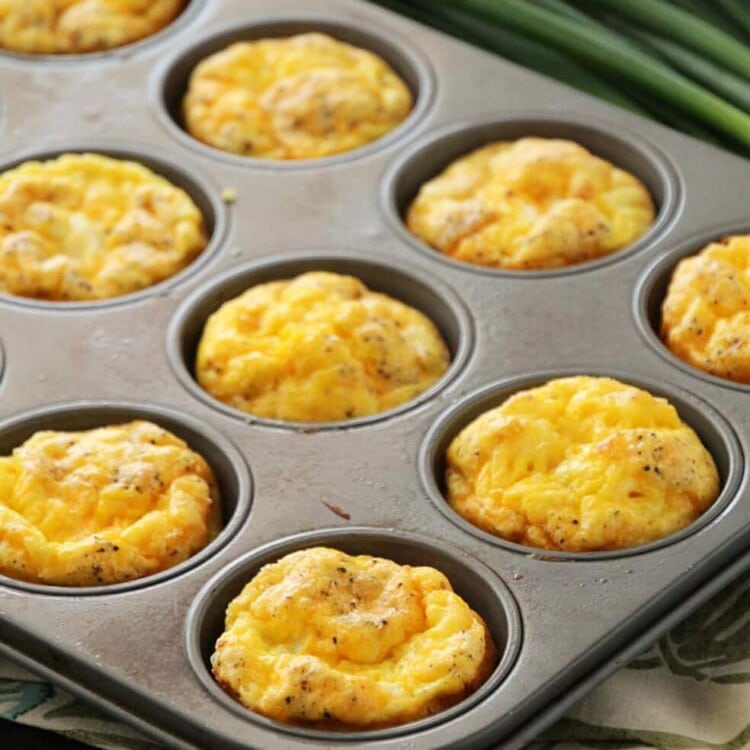 Ham and cheese egg muffins in a muffin tin