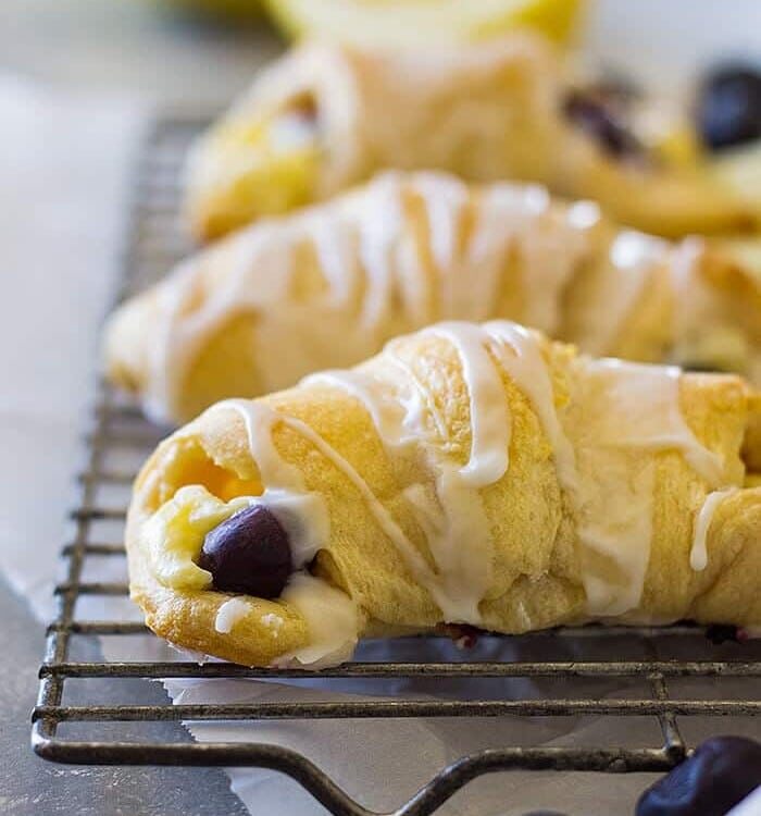 These Lemon Blueberry Cheesecake Crescent Rolls are filled with creamy, sweet and tangy lemon filling and bursting with fresh blueberries!