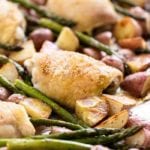 Simple chicken and vegetables on a sheet pan including asparagus and potatoes