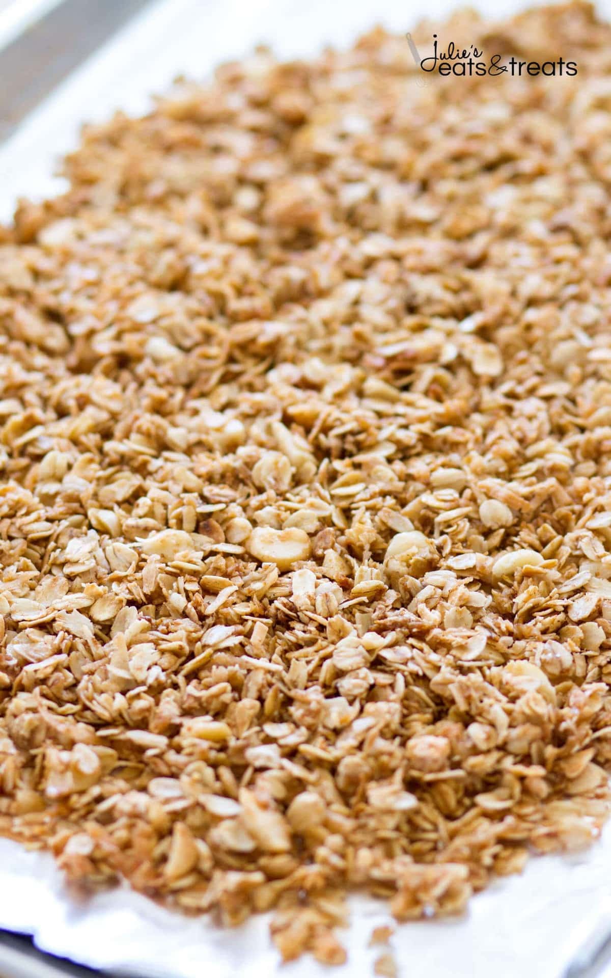This homemade Tropical Coconut Granola is filled with shredded coconut, coconut oil, and coconut sugar! Dried pineapple, apricots, golden raisins, cranberries, and macadamia nuts give this easy coconut granola a tropical flavor. This homemade granola recipe is so easy, you may never buy store-bought again!