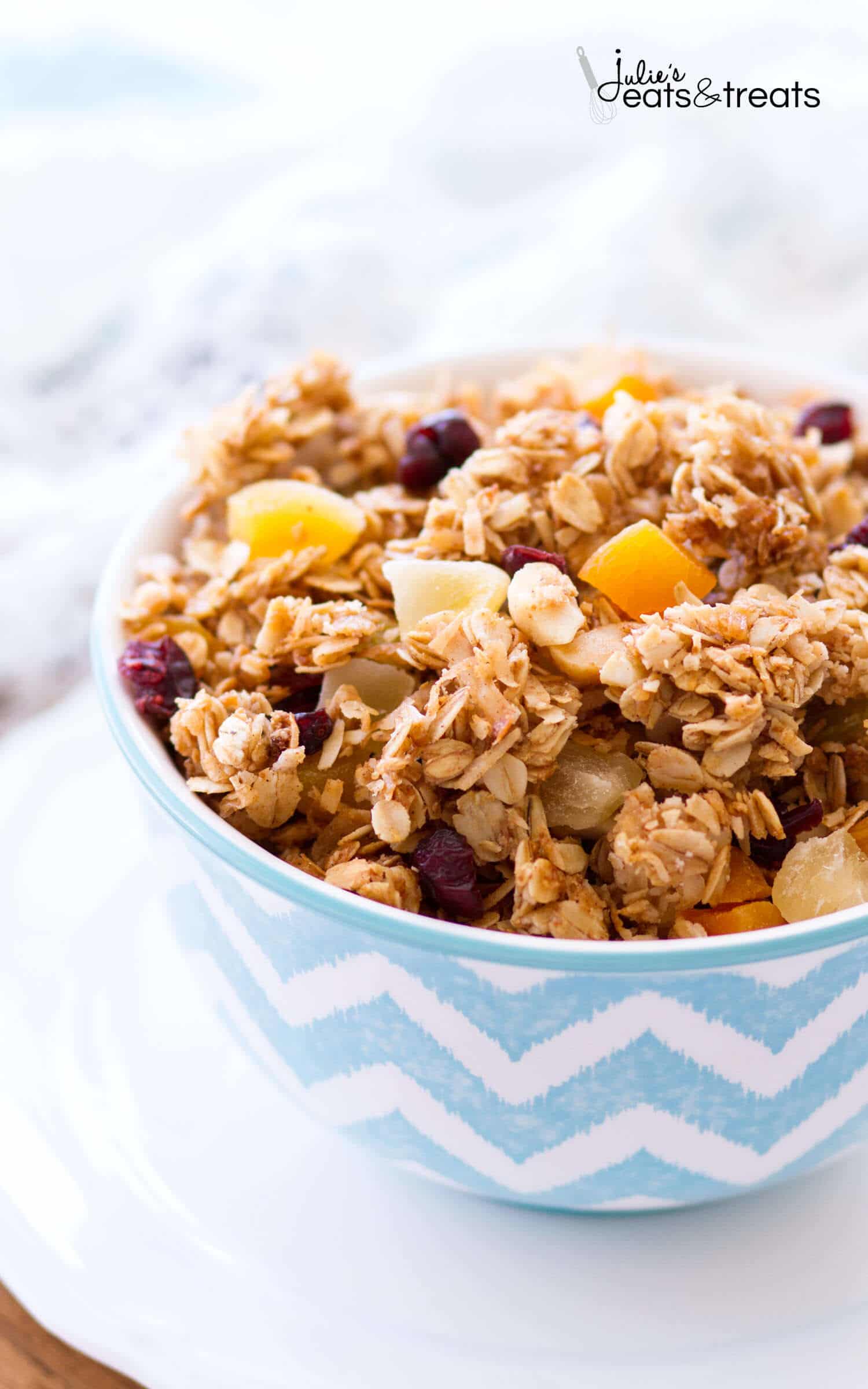 This homemade Tropical Coconut Granola is filled with shredded coconut, coconut oil, and coconut sugar! Dried pineapple, apricots, golden raisins, cranberries, and macadamia nuts give this easy coconut granola a tropical flavor. This homemade granola recipe is so easy, you may never buy store-bought again!