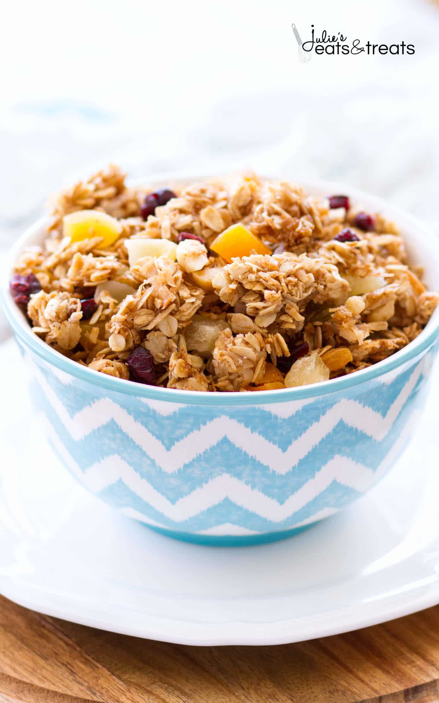 This homemade Tropical Coconut Granola is filled with shredded coconut, coconut oil, and coconut sugar! Dried pineapple, apricots, golden raisins, cranberries, and macadamia nuts give this easy coconut granola a tropical flavor. This homemade granola recipe is so easy, you may never buy store-bought again!