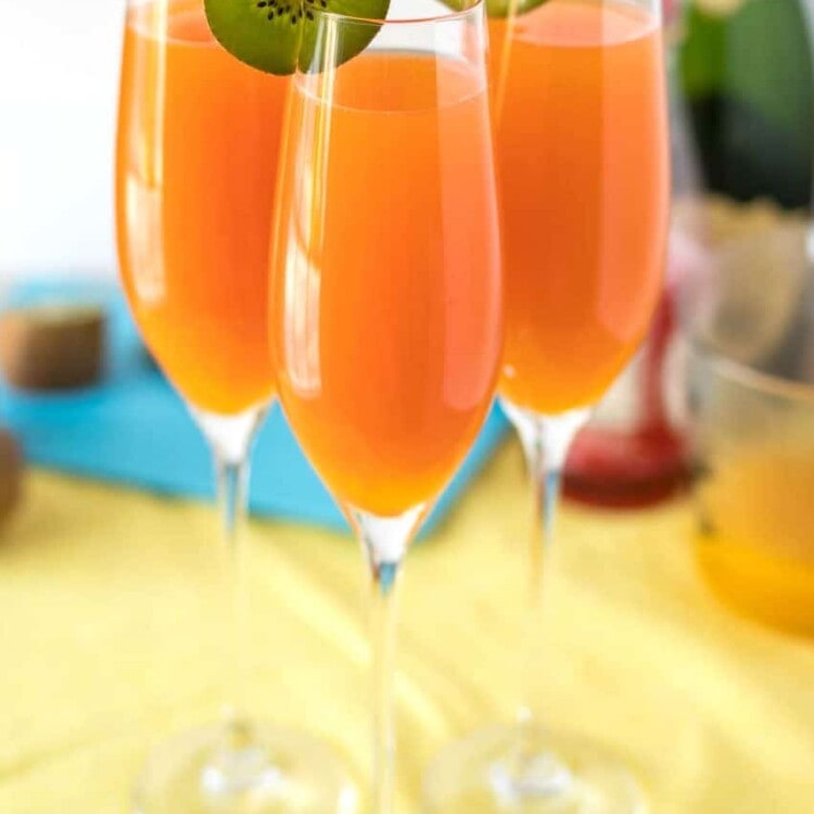 Tropical Mimosas - The classic brunch drink, given a tropical twist with the addition of mango, pineapple, and a splash of grenadine.