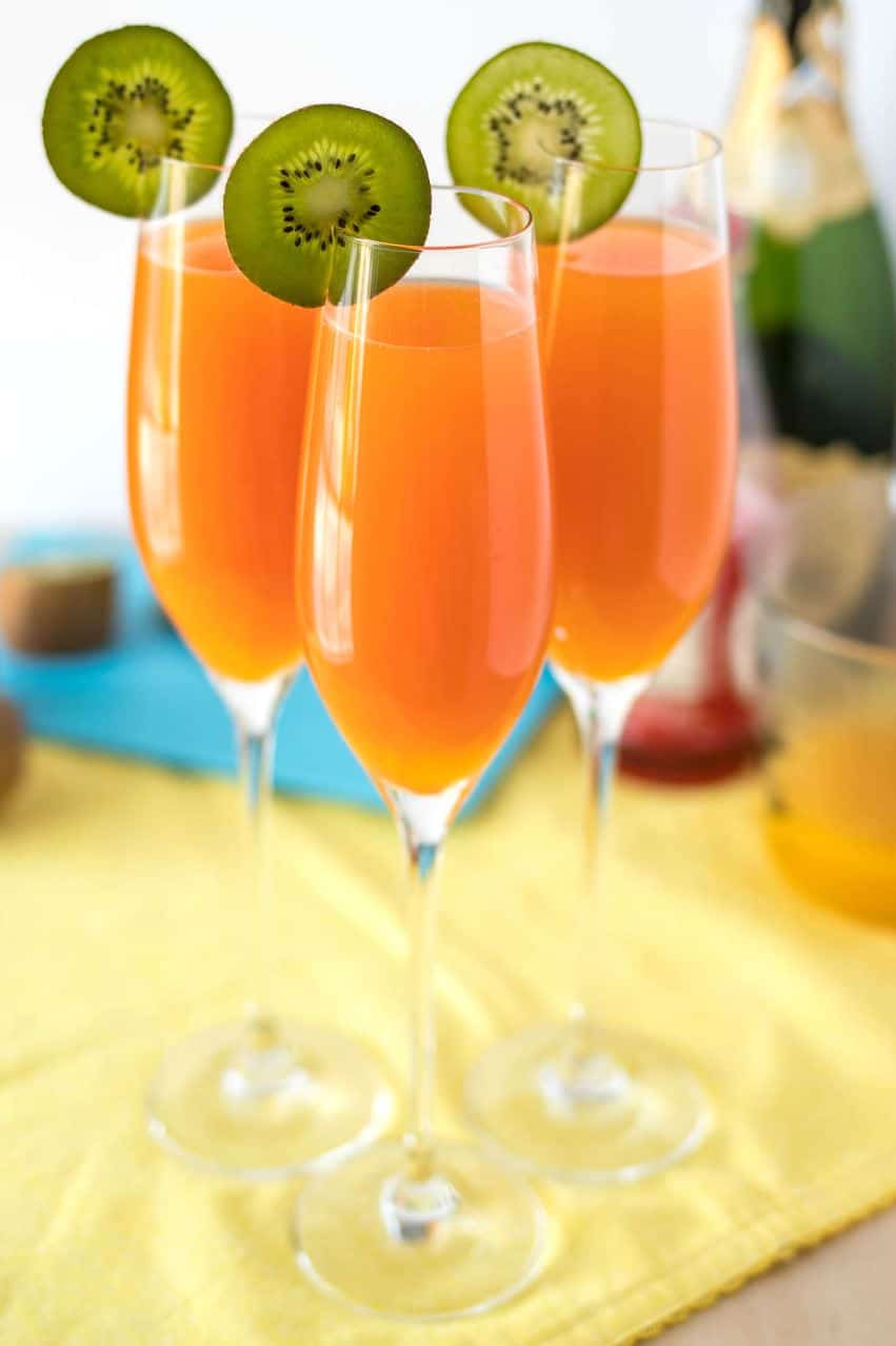 Tropical Mimosas - The classic brunch drink, given a tropical twist with the addition of mango, pineapple, and a splash of grenadine. 