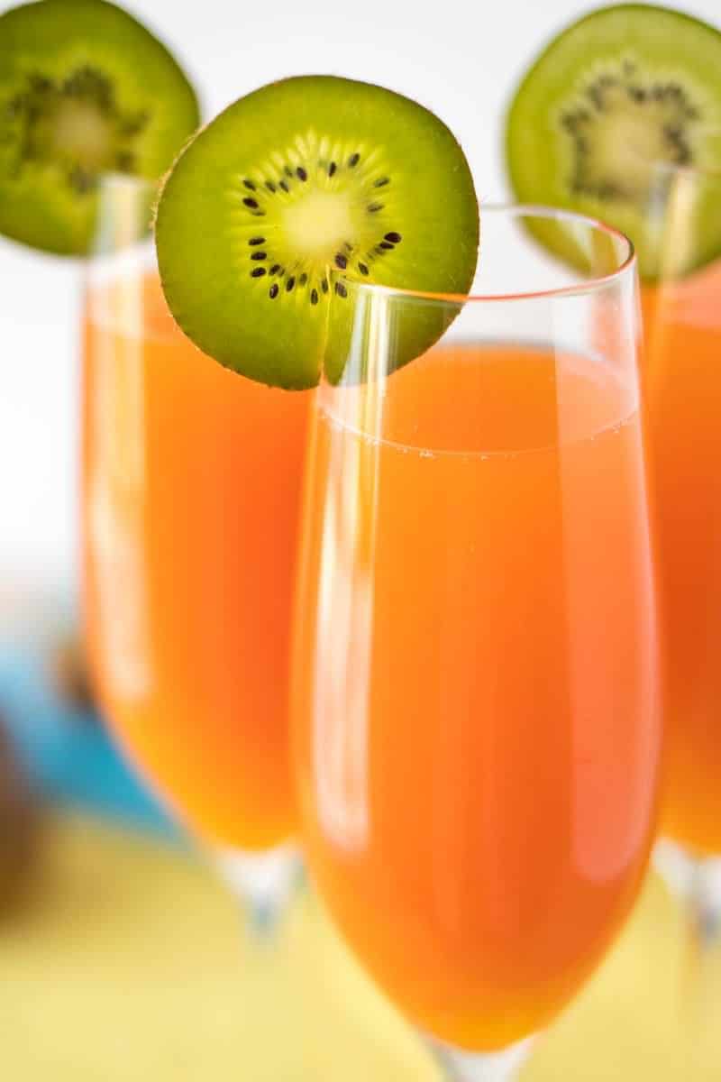 Tropical Mimosas - The classic brunch drink, given a tropical twist with the addition of mango, pineapple, and a splash of grenadine.