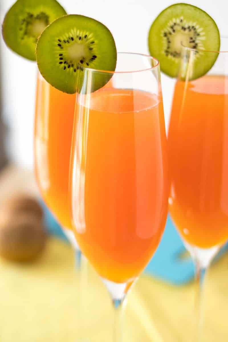 Tropical Mimosas - The classic brunch drink, given a tropical twist with the addition of mango, pineapple, and a splash of grenadine.